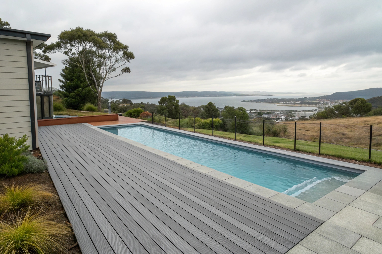 Composite pool decking installation around backyard pool in Hobart Tasmania